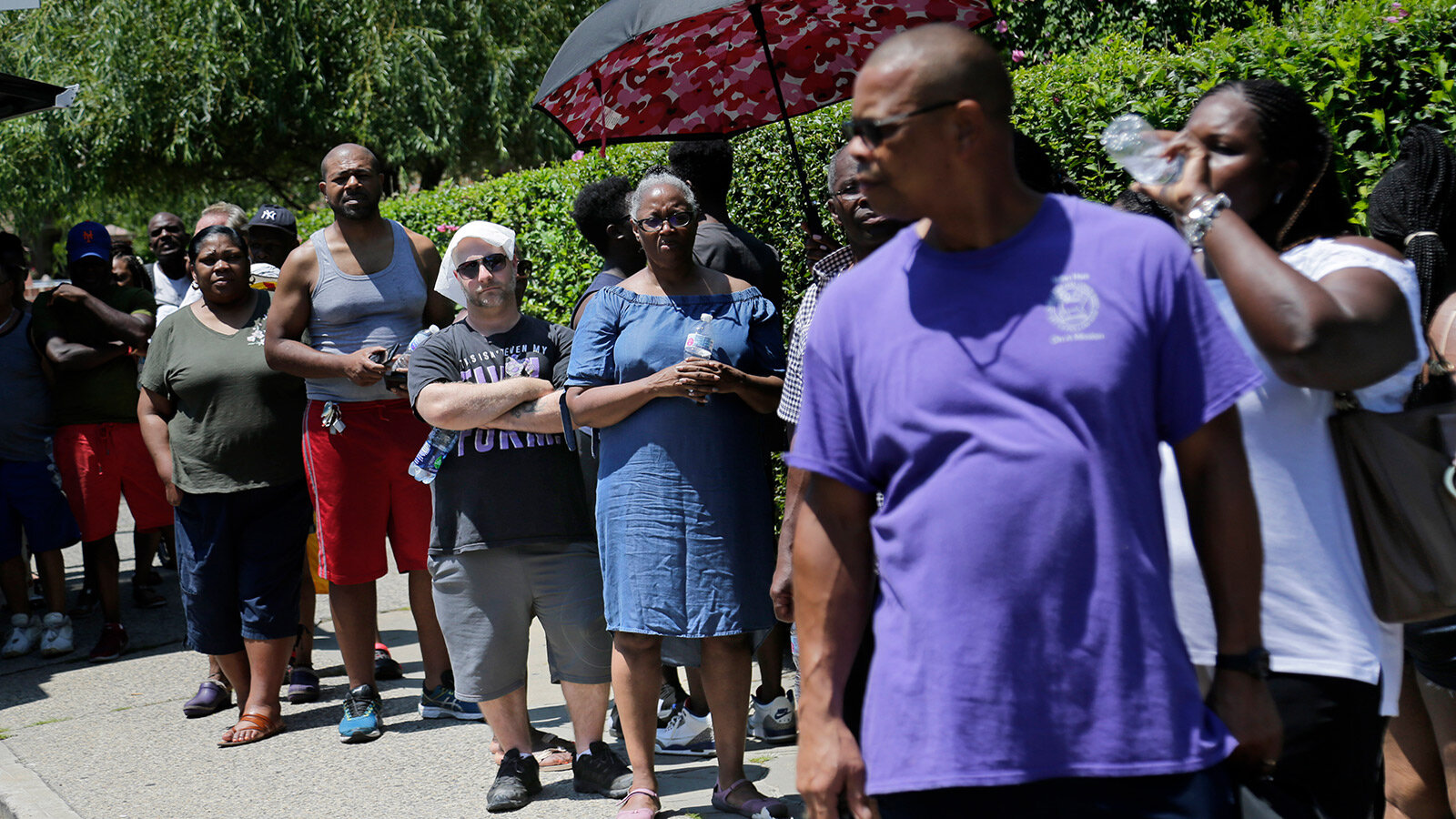 People line up to get dry ice from a Con Edison truck in a neighbourhood without power in the Brooklyn borough of New York, Monday, July 22, 2019. Seth Wenig / AP Photo